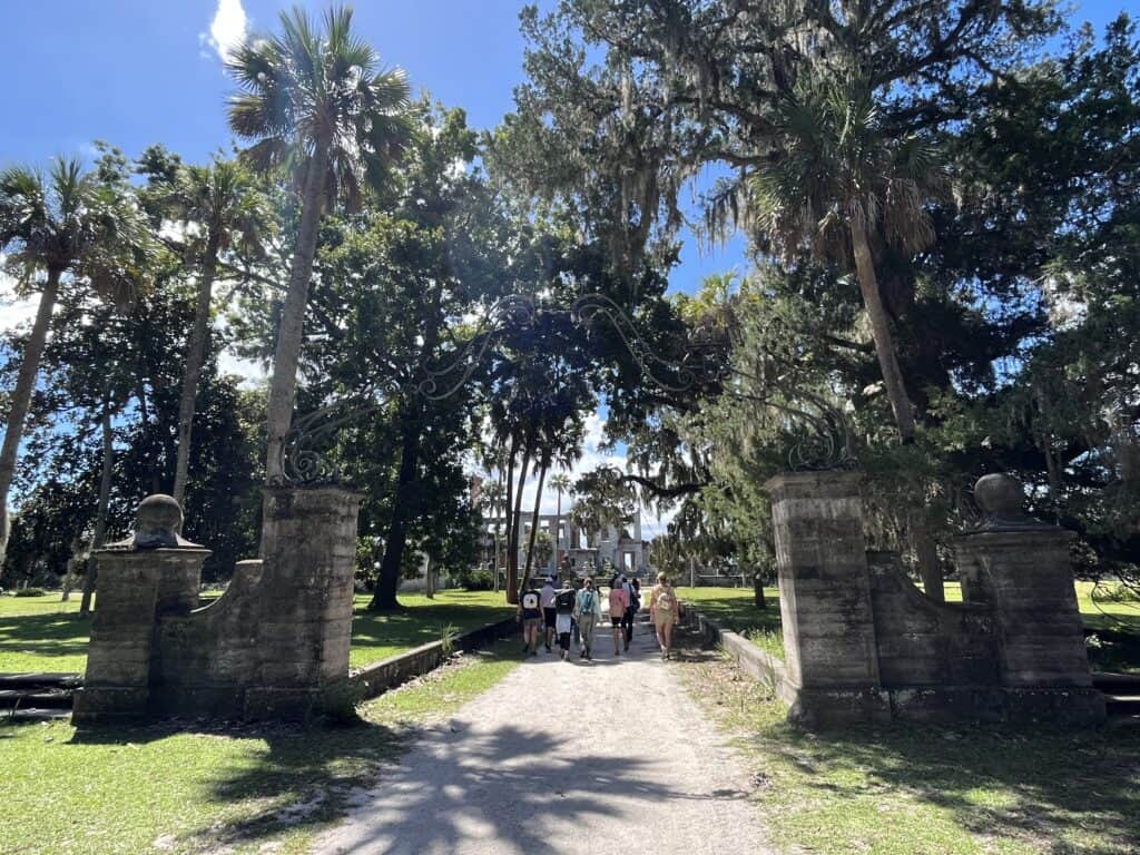 Molly's Old South Tours group entering iron gates of the Carnegies' Dungeness Mansion Area