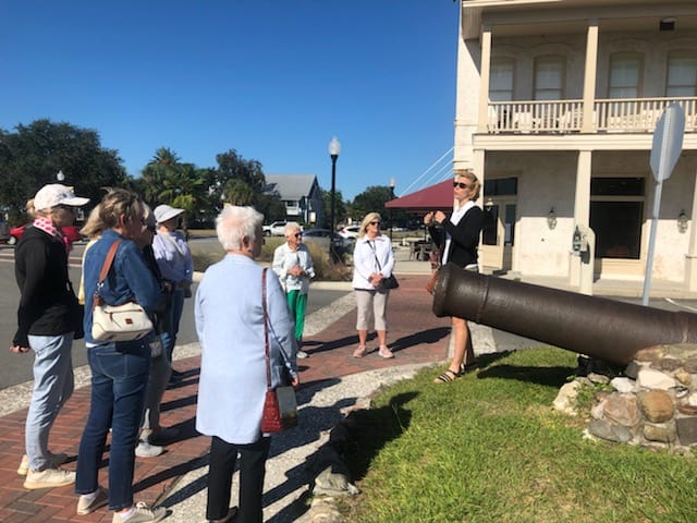 Molly's Old South Tours group taking a closer look at the historic cannon in downtown St. Marys