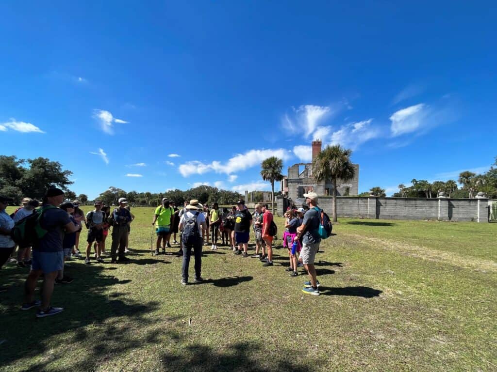 Molly's Old South Tours field trip group learning about the Carnegies' Dungeness Ruins on Cumberland Island