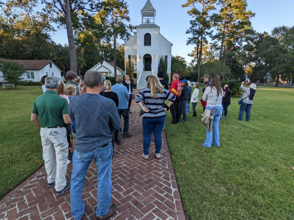 Molly's Old South Tours group discussing a horse in the bell tower of the First Presbyterian Church