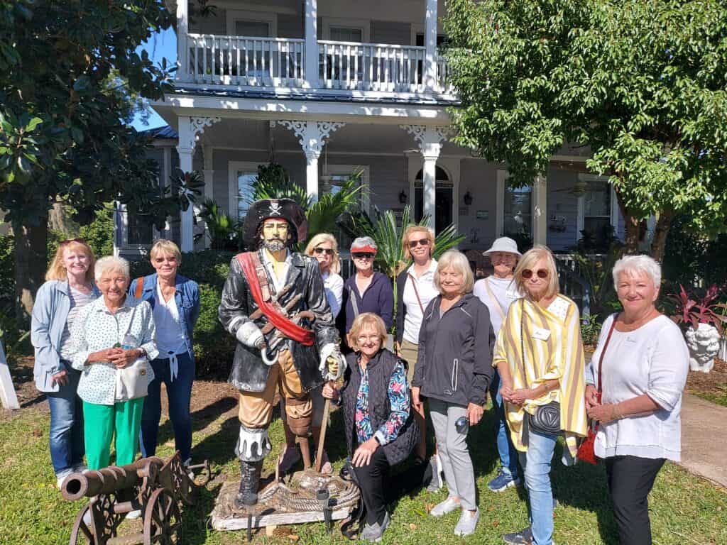 Molly's Old South Tours group befriending a St. Marys pirate at the Goodbread House, one of the VIP entrances on our tour