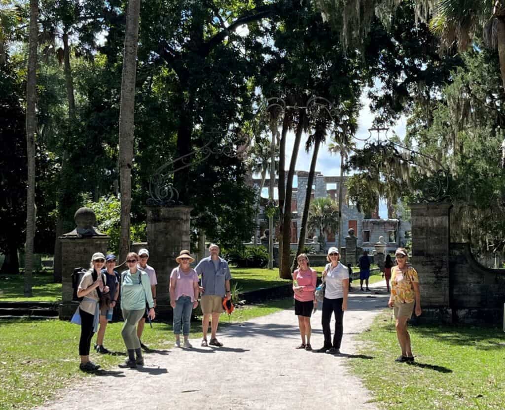 Molly's Old South Tours group at gate of Carnegies' Dungeness Mansion, Cumberland Island