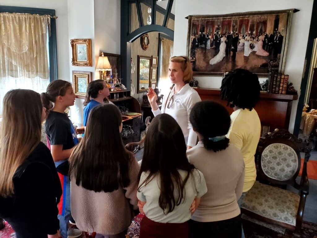 Molly's Old South Tours field trip group gaining VIP access to a historic home in St. Marys 