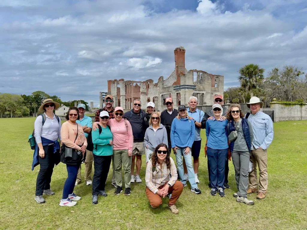 Molly's Old South Tours' private tour group posing in front of Dungeness Mansion