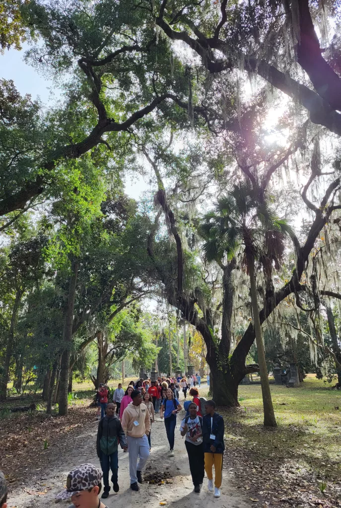 Molly's Old South Tours field trip group hiking in the maritime forest